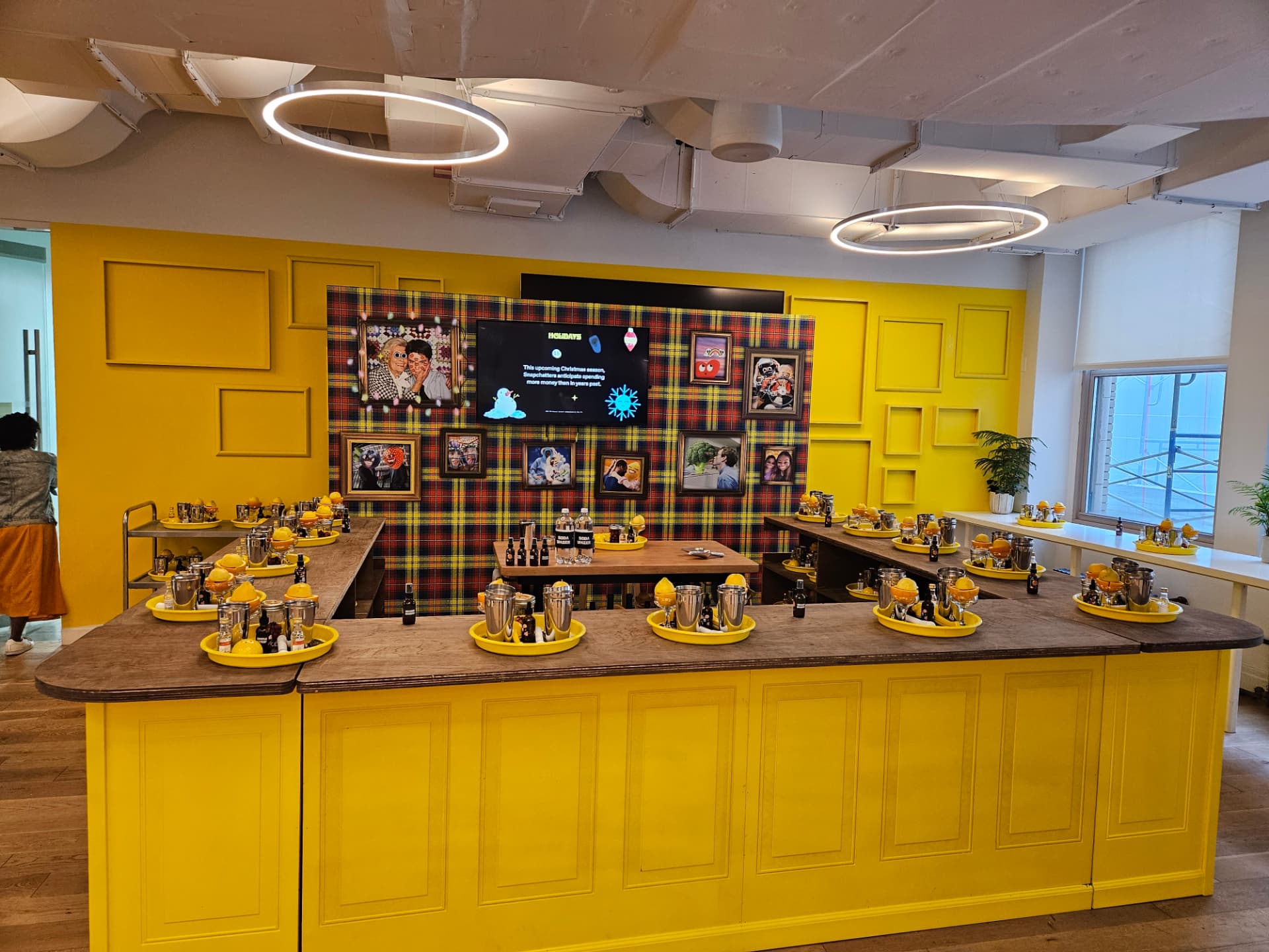 Hands-on holiday cocktail class stations with shakers and citrus at a Robotproof brand experience