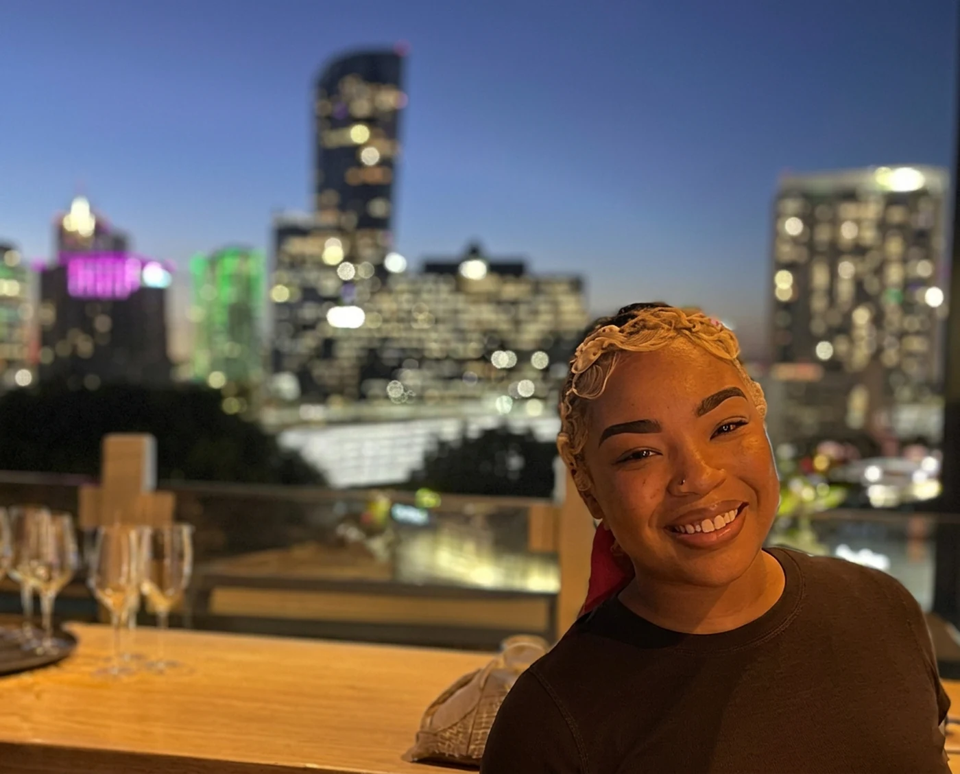 Rooftop mixologist crafting signature cocktails at an upscale city event — bartender for hire by Majestic Maraschinos